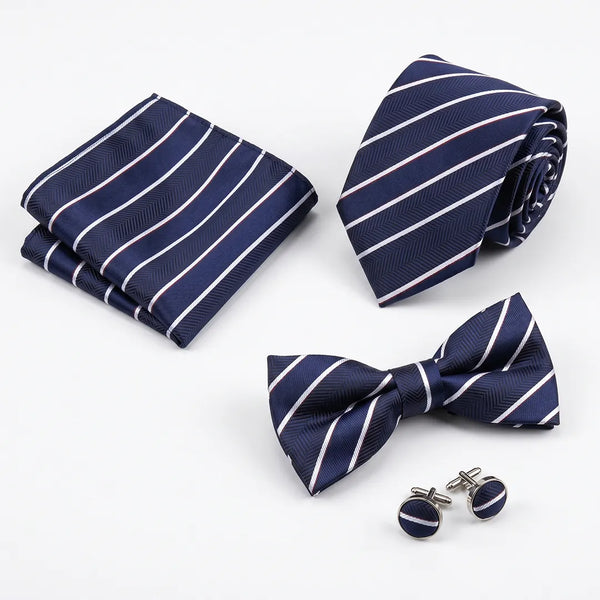 Flat lay of a Sailor Australia navy herringbone stripe 4-piece tie set including a tie, pocket square, bow tie, and cufflinks.
