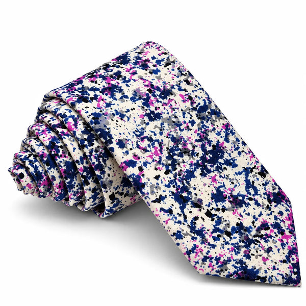 A rolled necktie with a dense multicolor paint splatter pattern on a white base, featuring prominent shades of navy blue, magenta pink, and black, set against a plain white background.