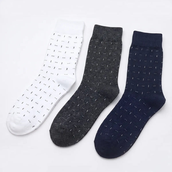 Flat lay of a 3-pack of men's dotted dash socks in white, dark grey, and navy blue.
