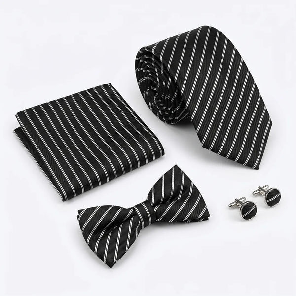 Flat lay of a Sailor Australia black and white stripe 4-piece tie set including a tie, pocket square, bow tie, and cufflinks.