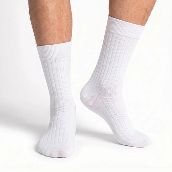 Close-up of a man's feet wearing classic white ribbed crew socks.