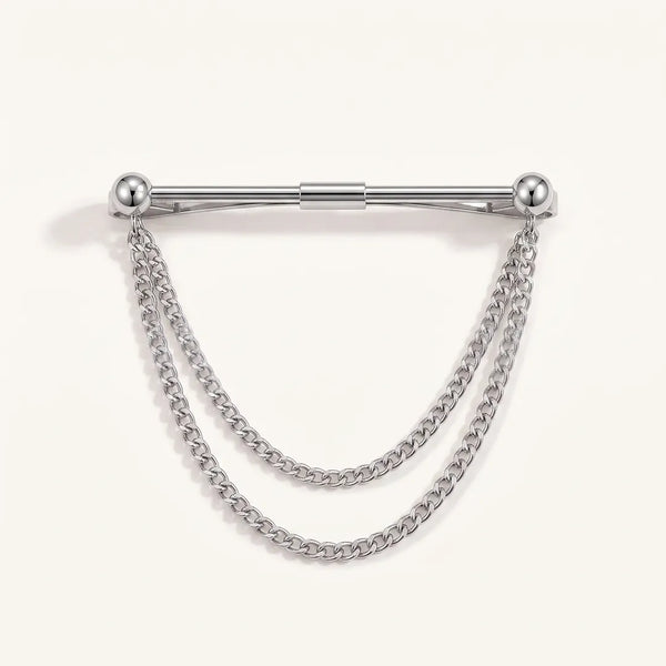 Close-up of a polished silver-tone horizontal collar pin with spherical ball ends and two tiered, draped curb chains.