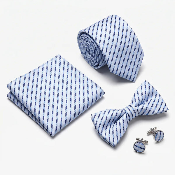 Flat lay of a Sailor Australia light blue and navy diagonal dash 4-piece tie set including a tie, pocket square, bow tie, and cufflinks.