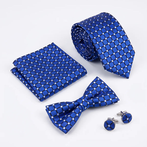 Flat lay of a Sailor Australia royal blue geometric 4-piece tie set including a tie, pocket square, bow tie, and cufflinks.