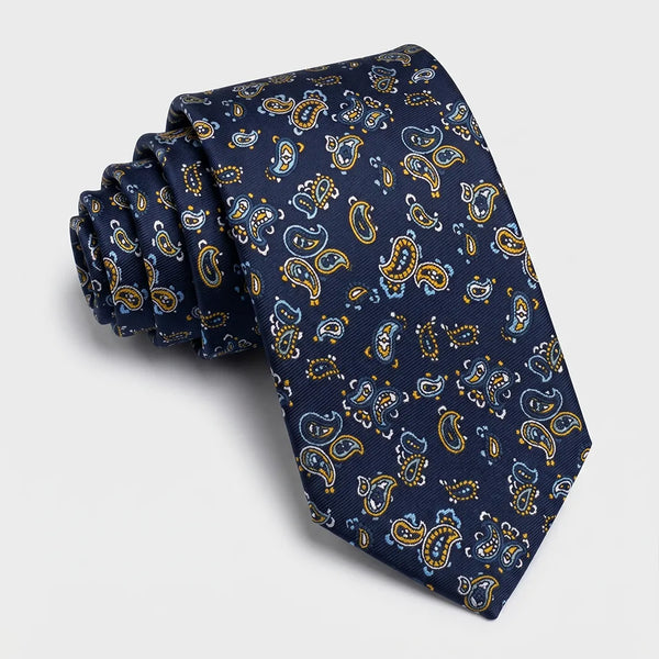 Close-up of a navy paisley tie featuring gold and light blue teardrop patterns on a smooth polyester fabric.