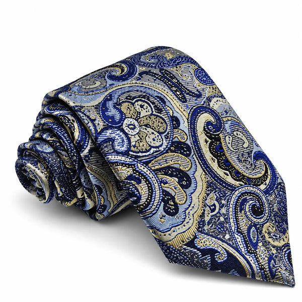 A rolled necktie with an intricate paisley pattern in shades of blue, navy, beige, and white, set against a plain white background.