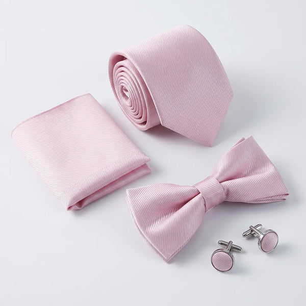 Flat lay of a Sailor Australia pink twill 4-piece tie set including a tie, pocket square, bow tie, and cufflinks.