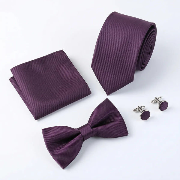 Flat lay of a Sailor Australia plum twill 4-piece tie set including a tie, pocket square, bow tie, and cufflinks.