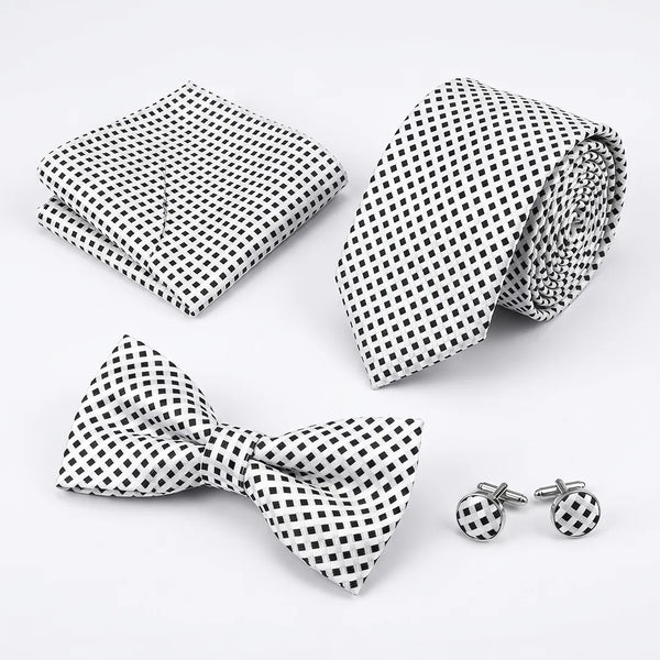 Flat lay of a Sailor Australia white and black micro-check 4-piece tie set including a tie, pocket square, bow tie, and cufflinks.
