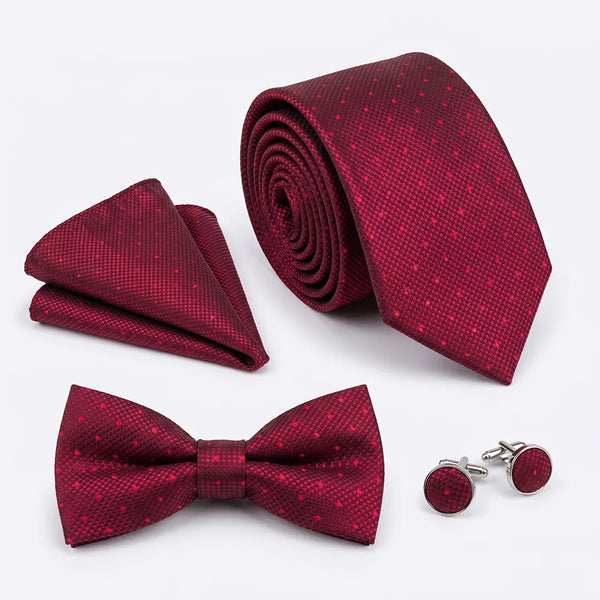 Flat lay of a Sailor Australia burgundy micro-dot 4-piece tie set including a tie, pocket square, bow tie, and cufflinks.