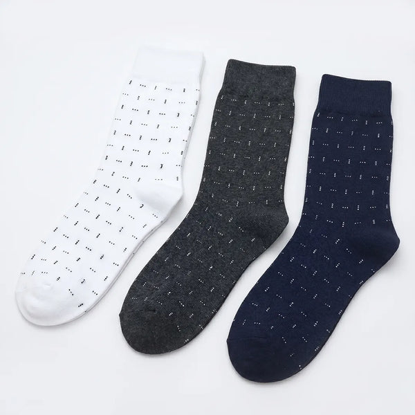 Flat lay of a 3-pack of men's dotted dash socks in white, dark grey, and navy blue.