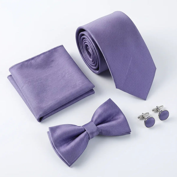Flat lay of a Sailor Australia lavender twill 4-piece tie set including a tie, pocket square, bow tie, and cufflinks.