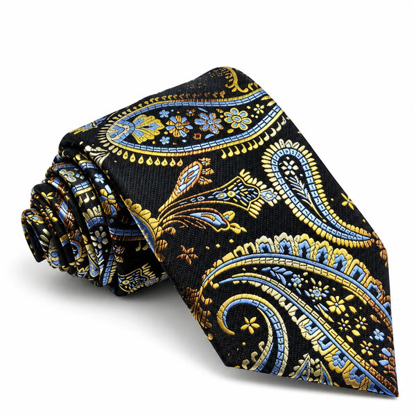 A rolled necktie with a detailed paisley pattern in gold, blue, and white on a black background, set against a plain white studio background.