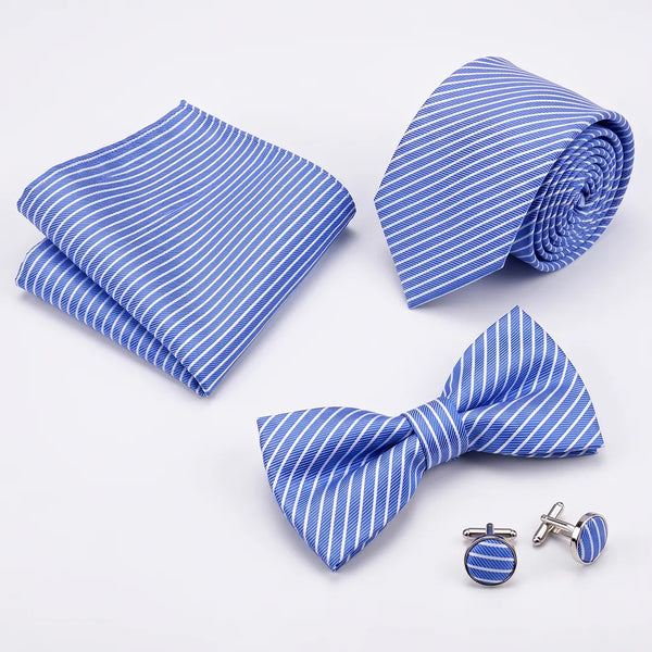 Flat lay of a Sailor Australia blue and white stripe 4-piece tie set including a tie, pocket square, bow tie, and cufflinks.