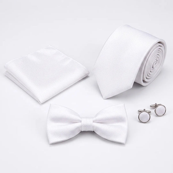 Flat lay of a Sailor Australia white textured 4-piece tie set including a tie, pocket square, bow tie, and cufflinks.