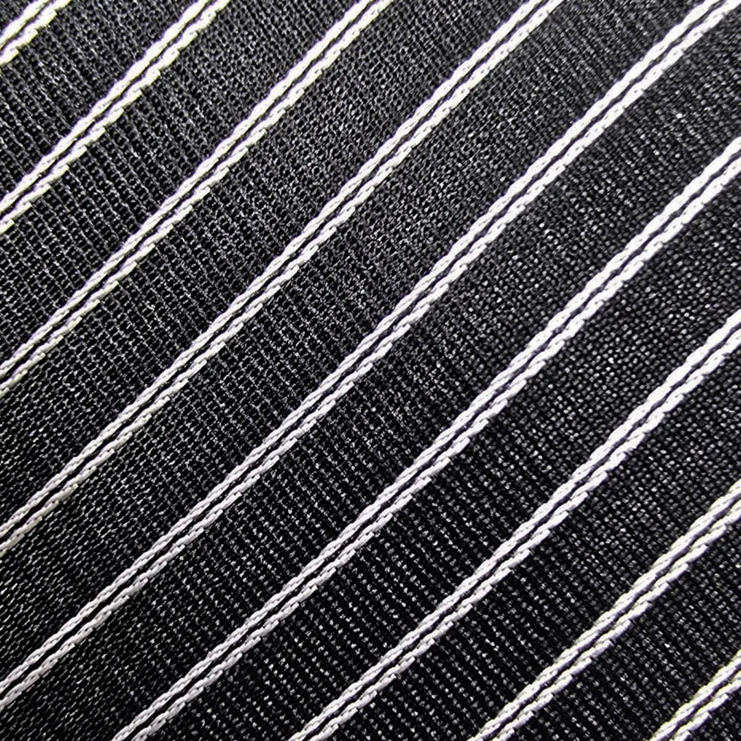 Close-up of a black woven fabric with diagonal white pinstripes.