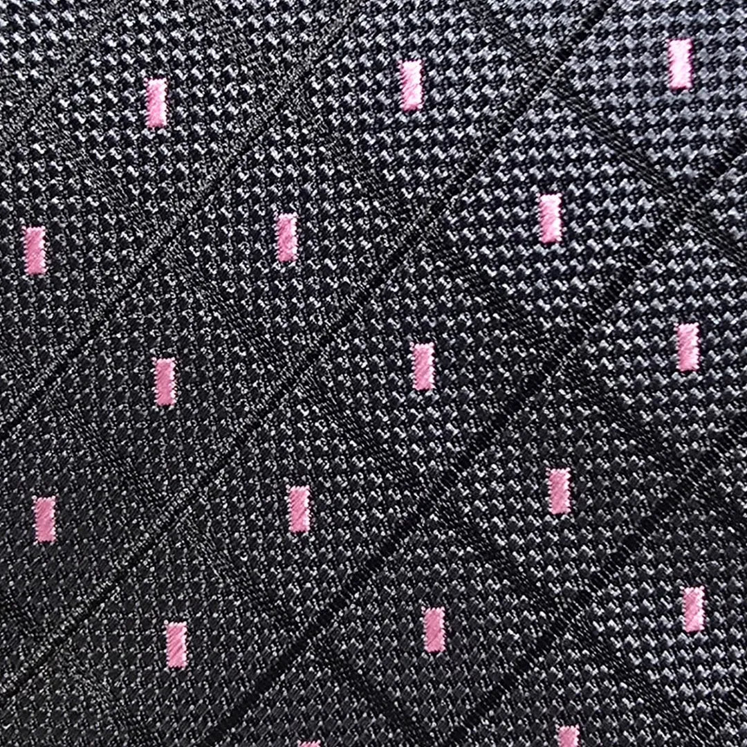 A close-up of a textured black woven fabric with a subtle diamond pattern and small, evenly spaced pink rectangular accents.