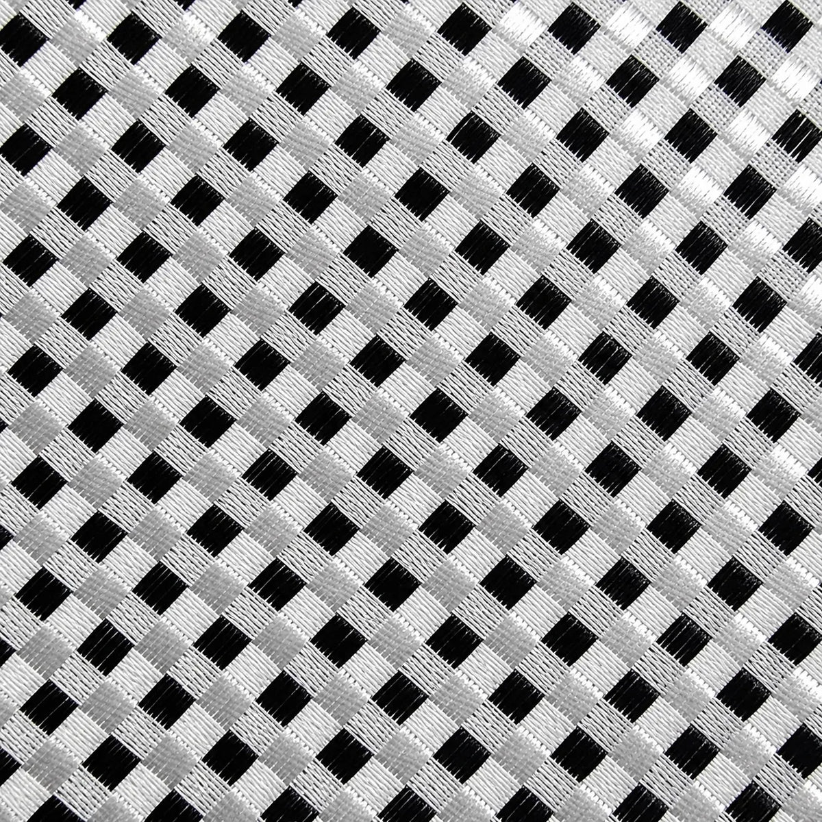A close-up of a woven fabric pattern featuring a black and white gingham check design.