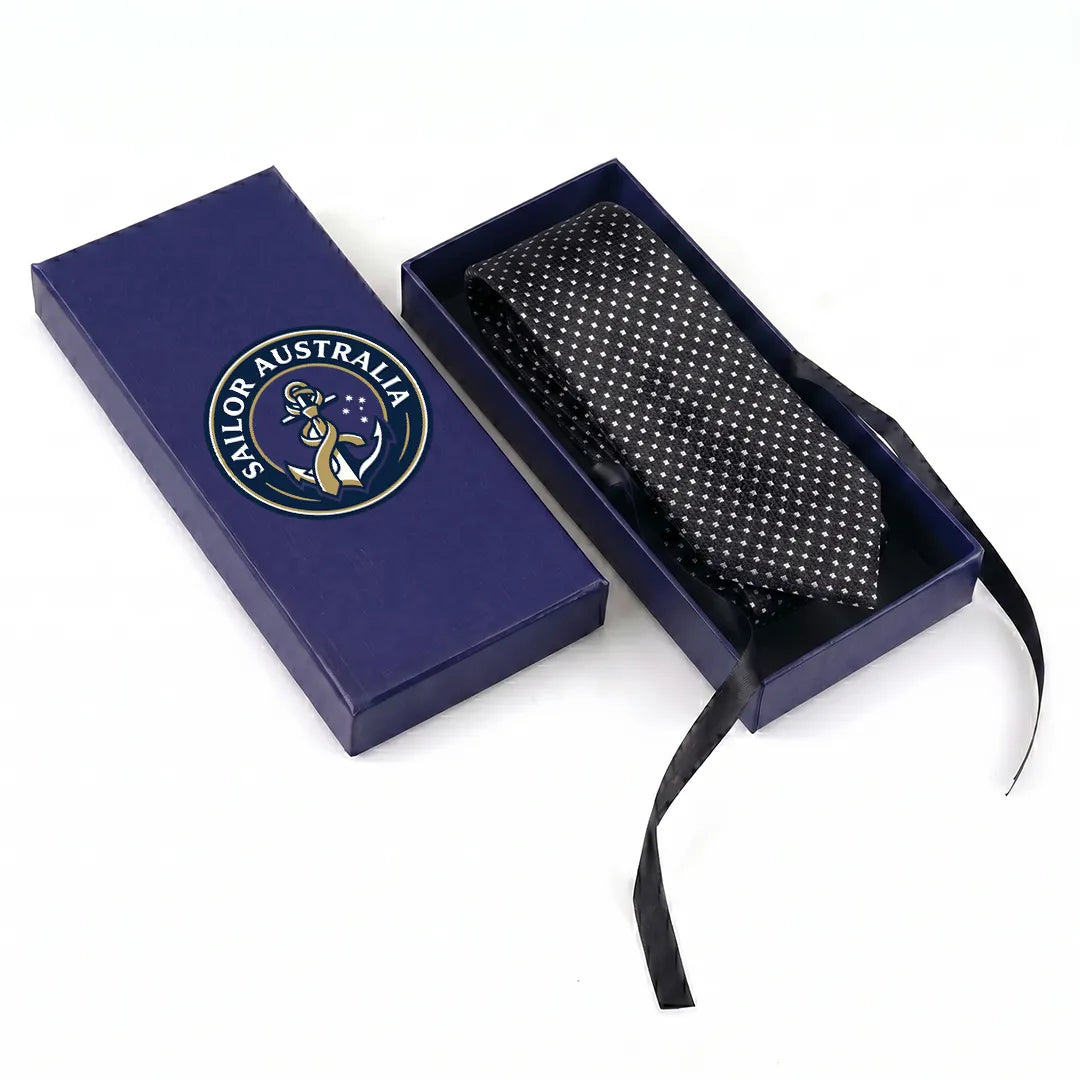 Sailor Australia black and silver micro-dot skinny tie displayed inside its premium branded navy blue gift box.